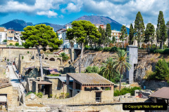 View of the roman ruins of the ancient archaeological site of Herculaneum and the Mount Vesuvius in Ercolano, Italy