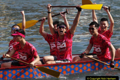 Participants celebrate winning a dragon boat race in Hong Kong Tuesday, May 30, 2017, as part of celebrations marking the Chinese Dragon Boat Festival, held throughout the islands. (AP Photo/Vincent Yu)