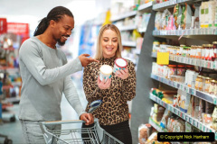 Multi-ethnici couple choosing between two ice cream flavour