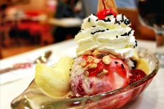 The sundae is a sweet ice cream dessert. It typically consists of one or more scoops of ice cream topped with sauce or syrup, and in some cases other toppings including sprinkles, whipped cream, maraschino cherries, or other fruits (e.g., bananas and pineapple in a banana split.). According to the Oxford English Dictionary, the origin of the term sundae is obscure; however, it is generally accepted that the spelling "sundae" derives from the word Sunday. This comes from the tradition that a sp