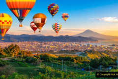 Landscape of Fuji Mountain and fresh green tea field with colorful hot air balloon at Nihondaira, Shizuoka, Japan