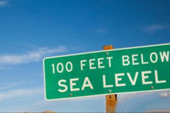 A road sign indicates an area of Death Valley that is 100 feet below sea level. The lowest point of elevation in North America is located within Death Valley National Park, at Badwater Basin, which is 282 feet (86 m) below sea level.