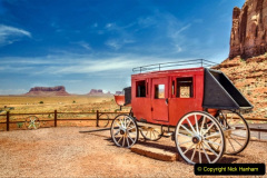 An old stagecoach and blue sky at Monument Valley, Arizona