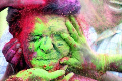 A boy reacts as his face is smeared with colored powder during Holi, the Hindu festival of colors, in Calcutta, India. (AP Photo/Sucheta Das)