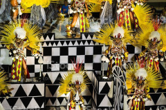Rio de Janeiro, Brazil - February 16th, 2015: Women participating in Samba Parade are dancing samba on top of lavishly decorated parade float. All participants are wearing elaborate costumes.