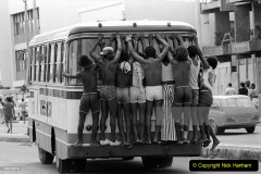 Brazilian boys travelling by holding on to the back of a bus. Rio de Janeiro, May 1977 (Photo by Mario De Biasi/Mondadori via Getty Images)