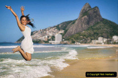 Brazilian woman jumping high at Ipanema beach in Rio de Janeiro