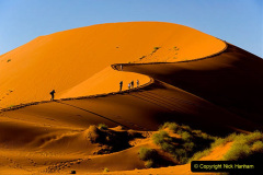 Tourists climbing Sossusvlei dune, Naukluft National Park, Namibia